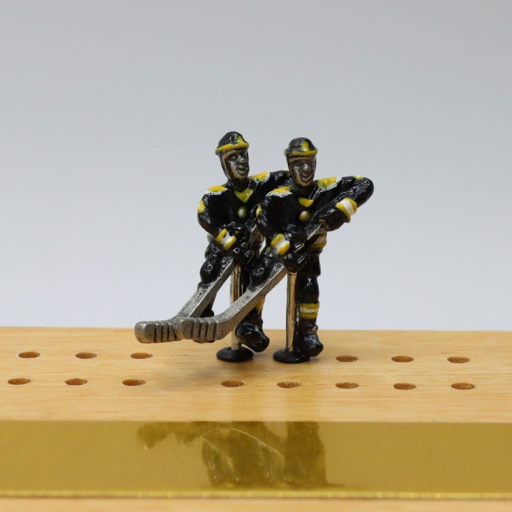 Hockey player cribbage pegs
